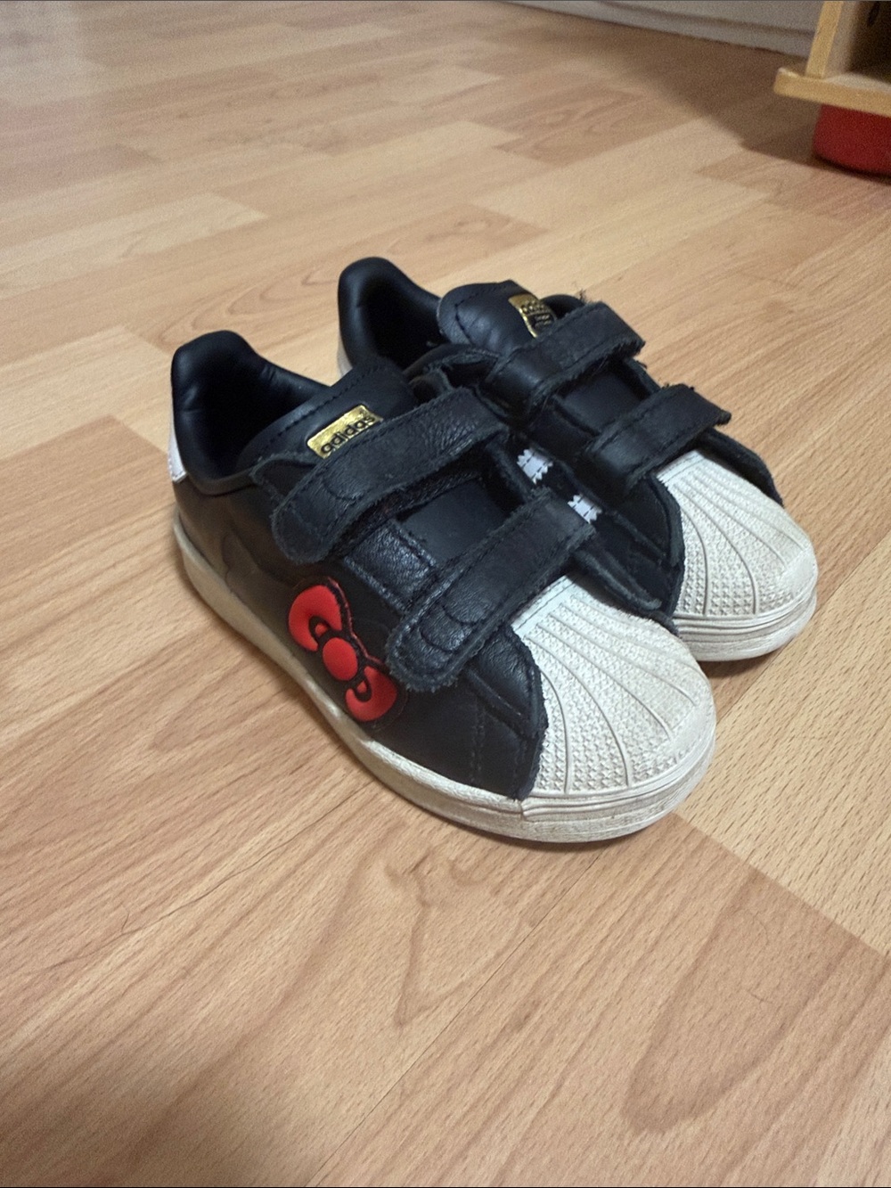 adidas Kids Black and White Hello Kitty Velcro Sneakers with Red Bow Accent